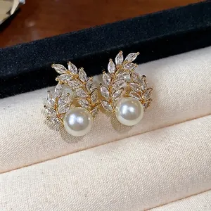 Elegant 18k gold plated wheat leaf design earrings with pearls and marquise crystals