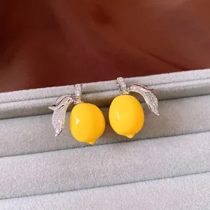 Sparkling lemon resin stud earrings with zircon stone leaves and sterling silver needles