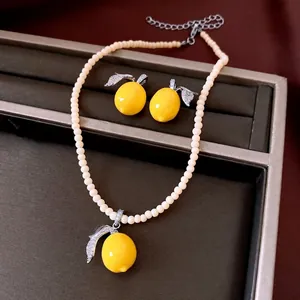 Elegant vintage lemon jewelry set featuring resin pendants and sparkling zircon leaf details