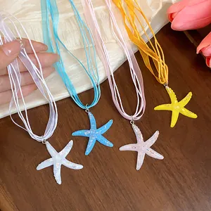 Colorful resin starfish necklaces with delicate ribbon strings for a stylish resort look.
