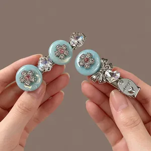 Detailed view of luxury rhinestone flower hair clips with always engraving and bow