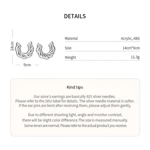 Detailed size and material specifications for silver twisted C-shaped stud earrings.