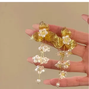 Elegant French vintage gold wire flower tassel earrings with delicate white floral details