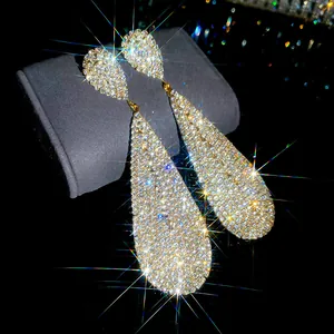 Luxury silver needle teardrop dangle earrings with full pavé rhinestone sparkling detail.