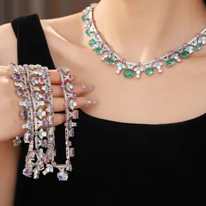 Elegant palace-style jewelry set with oval green and purple zircon necklaces and bracelets.