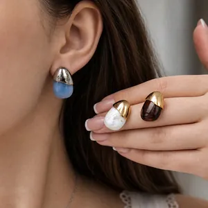 Minimalist stainless steel resin drop earrings in multiple colors shown on a model