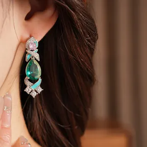 Exquisite court style teardrop zircon earring with blue enamel detailing on model