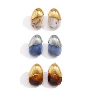 Set of minimalist stainless steel and resin stud earrings in three unique color combinations.