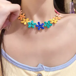 Close-up detail of bohemian colorful woven raffia flower necklace for a vacation