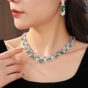 Detailed view of luxury palace style emerald green zircon necklace and earrings set