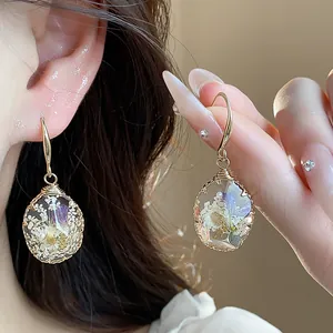 Elegant teardrop resin earrings with dried flowers, nature-inspired jewelry accessory for women