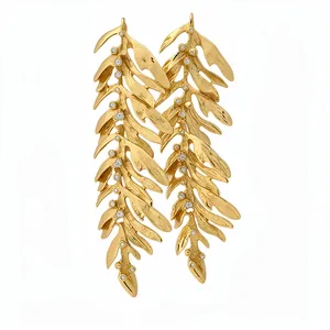 Elegant gold leaf tassel earrings with silver needles and sparkling micro cubic zircons.