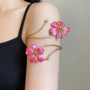 Elegant gold armlet featuring pink drip oil floral design for a luxury summer look