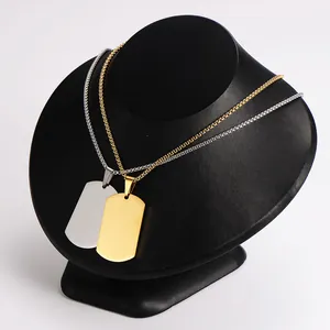 Close-up of silver and 18k gold plated mirrored blank dog tag necklaces for men.