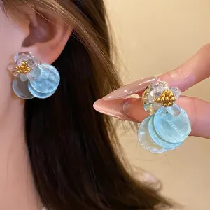 Summer silver needle earrings with light blue shell dangles and clear flowers