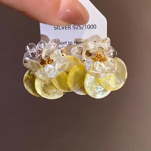 Elegant summer shell stud earrings with crushed stone flower design and yellow pendants