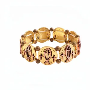 Retro religious elastic bracelet featuring gold-toned Ichthys fish and cross charm plates