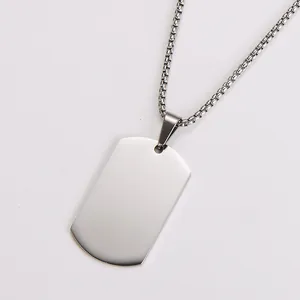Close-up of a minimalist polished stainless steel blank dog tag pendant necklace for men.