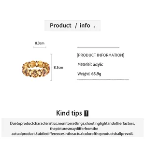 Acrylic bracelet info with fish and cross motifs and 8.3cm diameter measurement