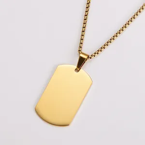 Macro view of a blank 18k gold plated stainless steel dog tag pendant with mirror finish