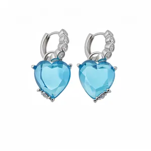 Elegant sterling silver hoop earrings featuring faceted heart-shaped blue zircon stones