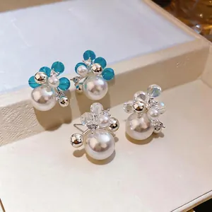 Elegant French style zircon pearl stud earrings with silver needles in a jewelry tray