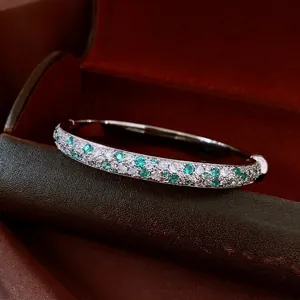 Mint green and white zircon pavé bangle in silver-tone finish for a luxury look