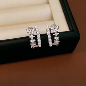 Elegant butterfly C-shaped double-layer earrings with pearls and zircons in silver