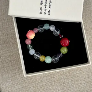 Colorful resin beaded bracelet with apple charms presented in a premium gift box