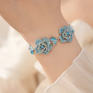 Detailed view of a vintage flower bracelet featuring turquoise and sparkling blue zircons