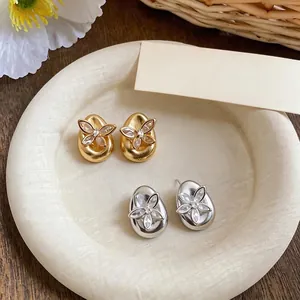 Elegant 18K gold plated teardrop stud earrings featuring sparkling butterfly zircon design.