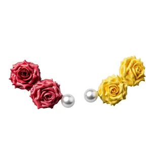 Sweet French resin rose flower and pearl earrings set in vibrant red and yellow hues.