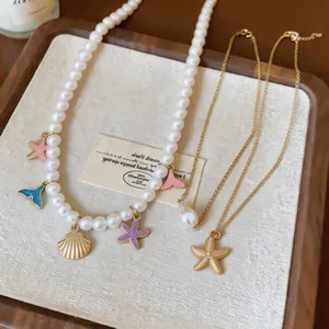 Close-up of beach-themed pearl necklace set featuring starfish and seashell charms