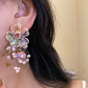 Elegant floral zircon stud earrings with dangling pearl tassels and a peach crystal charm