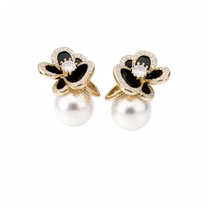 Elegant 14k gold plated flower stud earrings with white pearls and sparkling zircons