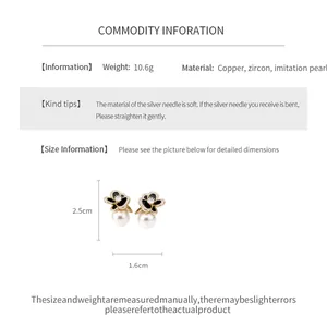 Detail view of flower pearl earrings with 2.5cm by 1.6cm dimensions