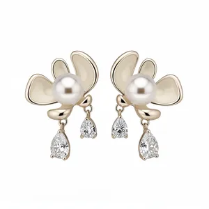 Elegant gold-plated flower earrings with white pearls and pear-cut crystal drops