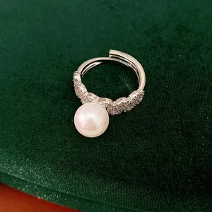 Elegant silver adjustable open ring featuring a round white pearl and pavé zircon.