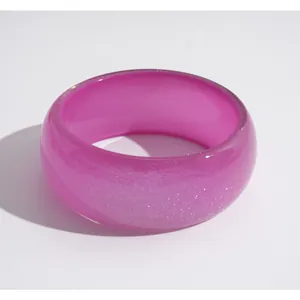Vibrant pink glitter resin round bangle bracelet for women in a minimalist style