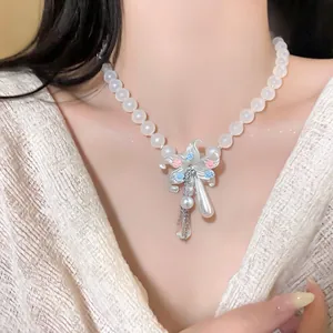 Detailed close-up of beaded flower necklace with pearls and elegant teardrop tassels