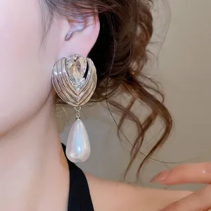 Elegant French style teardrop pearl earrings with luxury sparkling diamond stud details