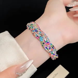 Close-up of elegant multi-layer braided bracelet with colorful rhinestones on a wrist