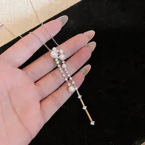 Detailed close-up view of elegant French style necklace with white pearls and zircons