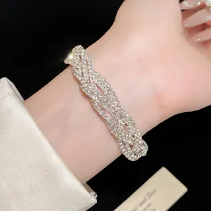 Close-up of multi-layer sparkling rhinestone bracelet on wrist for elegant style.