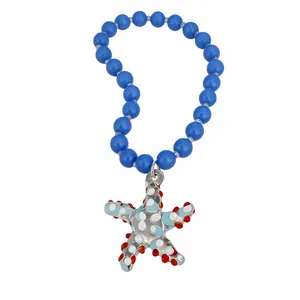 Vibrant blue glass bead necklace with colorful enamel starfish pendant for summer vacation.