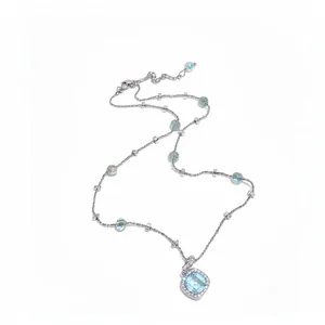 Elegant silver necklace featuring a light blue cushion-cut zircon pendant and beads