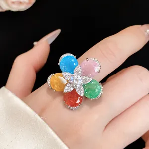 Close-up of vibrant multi-colored flower ring with sparkling zircon details