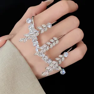 Detailed close-up showing shimmering marquise zircon stones in a wheat ear pattern ring