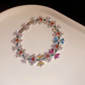 Elegant zircon bracelet featuring colorful flower patterns and shimmering gemstones on white plate
