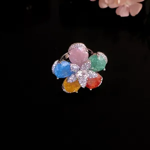 Detailed view of a silver flower ring with multi-colored teardrop cubic zirconia stones